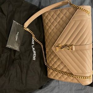 SAINT LAURENT MONOGRAM ENVELOPE BAG MADE WITH METAL-FREE TANNED LEATHER.